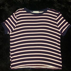 Red, navy, and white tee.